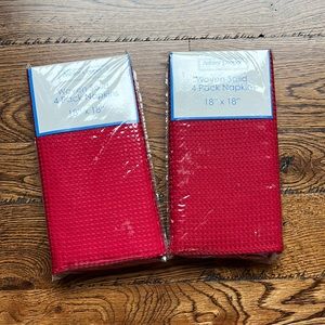 2 sets of 4 woven red cloth napkins, 18 X 18. Still in original packaging.
